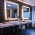 The Sound Hotel Seattle Belltown Tapestry Collection by Hilton bathroom with double sinks and city view in Seattle