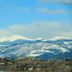 Renaissance Boulder Flatiron Hotel in Broomfield with snowy mountain views beyond the property