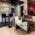 Hard Rock Hotel & Casino Biloxi lobby lounge with tan sectional, glass coffee table and bold wall art