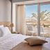 Tylissos Beach Hotel - Adults Only in Ierápetra room with sea-view balcony and palm tree outlook