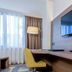 Nearport Hotel Sabiha Gokcen Airport room with desk, chair, wall-mounted TV and window in Istanbul