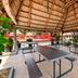 Super 8 by Wyndham Florida City/Gateway to Keys/Everglades outdoor thatched seating area with picnic tables