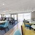 La Quinta Inn & Suites by Wyndham Bonita Springs Naples N. breakfast area with tables and chairs