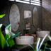 Phu Chom Mork Resort Sangkhla Buri bathroom with twin vessel sinks and oval mirrors