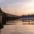 Greenbank Hotel, Falmouth: waterfront view at sunset with calm water and shoreline