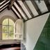 Hotel Spa La Central - Adults Only in Maçanet de Cabrenys, attic bathroom with arched window and green tile shower