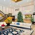 Ramada Plaza by Wyndham Garden Grove/Anaheim South lobby with Christmas tree, sofas, staircase and art