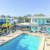 Uptown Inn & Suites in St. Petersburg with outdoor pool and two-story motel-style buildings