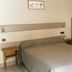 Hotel Le Centre in Brides-les-Bains room with double bed and wooden bunk bed