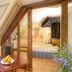 Trip Inn Hotel Der Adelshof in Schwäbisch Hall room with bed, dining table, and wood beams
