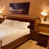 Le Club Boutique Hotel, Lecce: elegant guest room with king bed, bedside lamps and balcony door