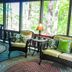 Pine Mountain Club Chalets Resort sitting area with wicker seating and forest views in Pine Mountain