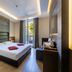 UNA Hotels Villa Dei Platani Foligno guest room with king bed, modern lighting and balcony view