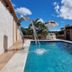 Jardim Do Eden Piri in Pirenópolis with outdoor pool, waterfall feature, and sunny patio