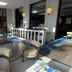 Hôtel des Eaux, Aix-les-Bains: stylish lobby lounge with curved chairs, blue rug and reception desk