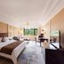 Paragon Hotel Xiangtan guest room with king bed, seating area and large window view