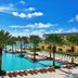 JW Marriott St. Maarten Beach Resort & Spa pool with palm trees and ocean view in Upper Prince's Quarter