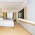 Ji Hotel Guiyang Fountain guest room with king bed, wall-mounted TV, and window seating in Guiyang