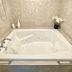 Bramblebank Cottages Harrison Hot Springs bathroom with jetted tub and tiled alcove