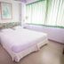 Lopburi Inn Hotel in Lop Buri guest room with bed, bedside tables and large window