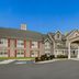 Red Roof Inn & Suites Knoxville East in Knoxville exterior with covered entrance and parking lot