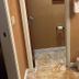 Mineral Palace Hotel & Gaming Deadwood bathroom entry with sink, towels, and tiled floor
