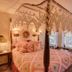 Woodstock Inn, Station and Brewery room with four-poster canopy bed and lace curtains in North Woodstock