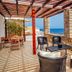 Kythea Resort in Agia Pelagia terrace with outdoor seating and sea view