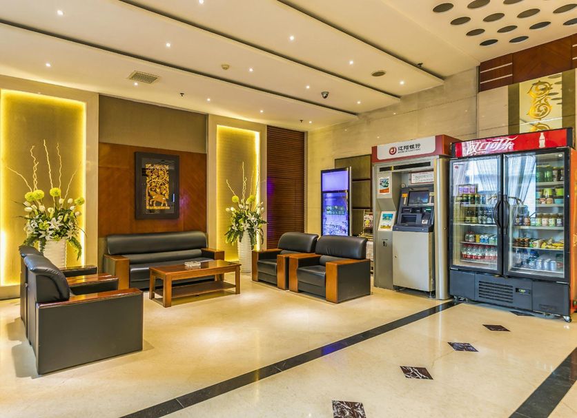 Grand View International Hotel in Liaoyang lobby seating area with beverage coolers and ATM