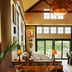 Berkshires Untold in Lenox, cozy lobby seating with leather sofas, tall windows, and forest views