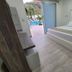 Hotel Kaamú Taganga guest room with king bed and view to poolside patio