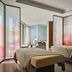 Rosewood Guangzhou spa treatment room in Guangzhou with two massage tables and floor-to-ceiling windows