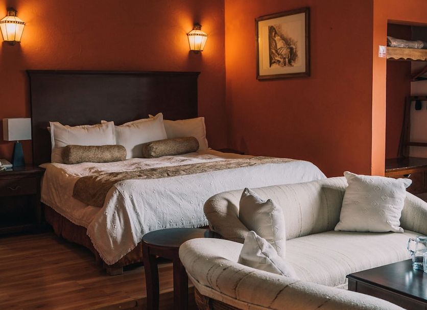 Hotel Casa Mexicana in San Cristóbal de las Casas guest room with king bed and seating area