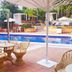 allsun Hotel Paguera Vera Beach in Peguera with a poolside terrace, wicker chairs and outdoor pool