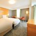 Richmond Hotel Premier Sendai Ekimae guest room with two beds, desk, and city-facing window in Sendai