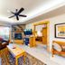 Canyon Creek in Steamboat Springs living room with leather seating, fireplace, TV, and balcony access