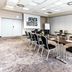 Meeting room at pentahotel Eisenach in Eisenach with a conference table and black chairs
