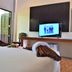B Square Hotel at Khanom guest room with twin beds and wall-mounted TV in Khanom
