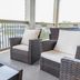 Hotel Whiskey in Pascagoula balcony with wicker seating and water view