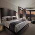 Hotel Yellowstone at Jackson Hole guest room with king bed and mountain-view balcony in Jackson