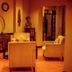 Heritage By Serendib in Blantyre lounge with armchairs, sideboard, decorative clock and statue