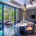 The Sakala Resort Bali All Suites in South Kuta suite with balcony, TV, round table and garden view