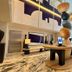 Hotel Park Ave Nyc lobby with marble floor, sculptural centerpiece, and large city artwork in New York