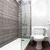 Yarnfield Park Training And Conference Centre bathroom with shower, toilet and sink in Stone