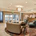 Homewood Suites by Hilton Salt Lake City Airport lobby with seating area and front desk