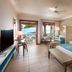 Constance Belle Mare Plage room with king bed, sitting area and balcony view toward the ocean in Belle Mare