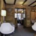 Le Saint Antoine, Les Houches: modern lobby with white chairs, wood-paneled walls and office seating