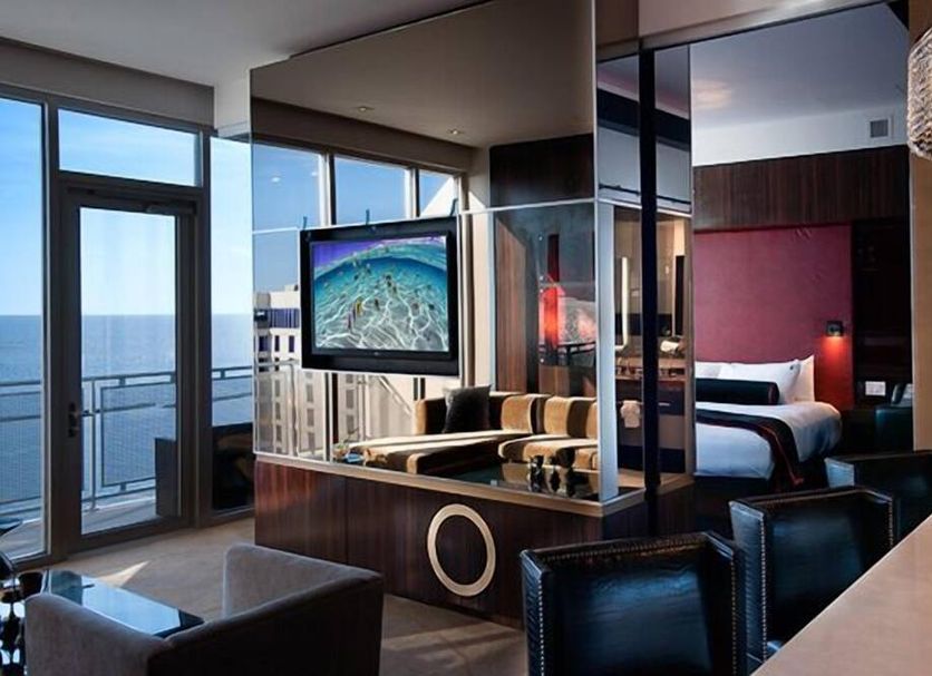 Hard Rock Hotel & Casino Biloxi guest room with ocean view and glass-walled bathroom