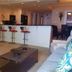 Treasure Island Resort by Royal American Beach Getaways living room with kitchen bar in Panama City Beach