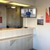 Motel 6 Santa Rosa Nm lobby front desk with TV and wall signage in Santa Rosa